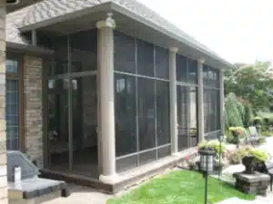 Model 100 screen room with a sturdy frame, mesh panels, and decorative columns for a refined outdoor living space.