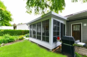 Sunspace SunRooms - Model 200 attached to a home, featuring large screened windows and a modern design.