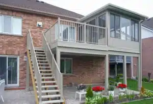 Insulated Sunroom installed on an elevated deck, featuring large glass windows for a bright and comfortable outdoor living space.