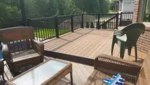 Trex Composite Decking installed on an outdoor deck with black metal railings, offering a durable and stylish outdoor living space.